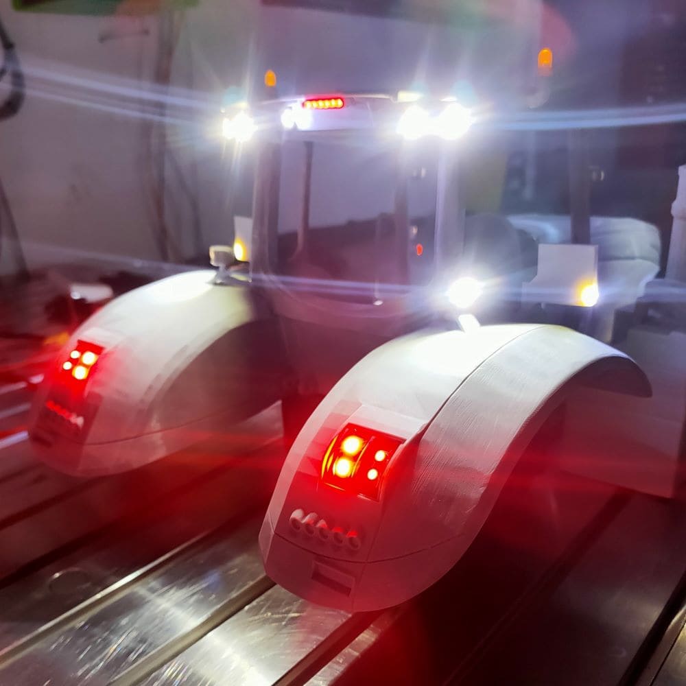 Even inspecting behind the tractor at night is not an issue